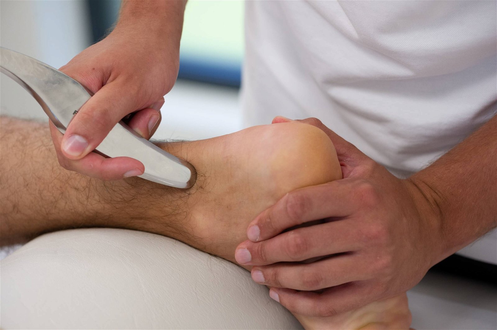 rehabilitation of Achilles tendon by a physiotherapist using specialized tools