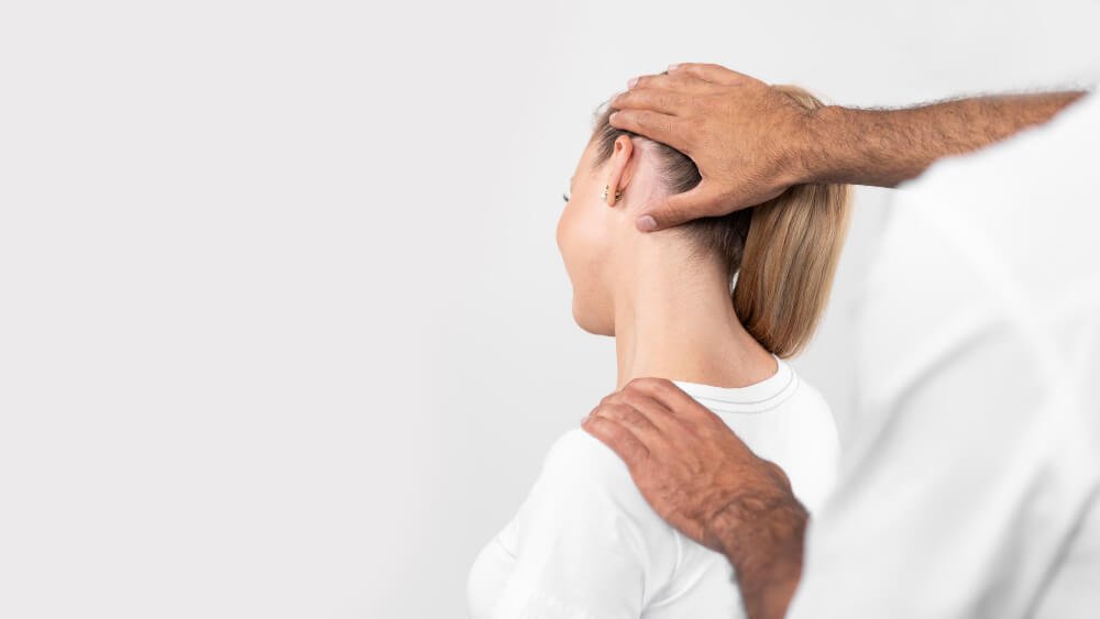 phsyiotherapist checking the neck area