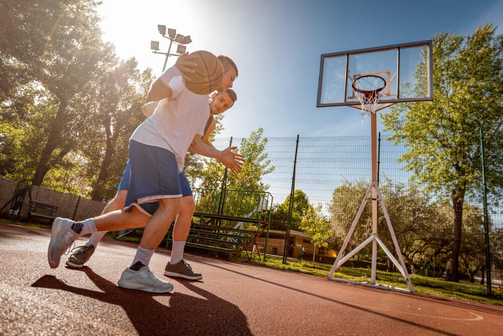 two kids playing basketball